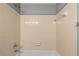 Neutral bathroom featuring tiled walls, updated shower fixtures, and a clean, bright aesthetic at 1371 Keys Lake Ne Dr, Brookhaven, GA 30319