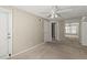 Bright bedroom featuring neutral walls, ceiling fan, carpet, and an entrance to the outside patio at 1371 Keys Lake Ne Dr, Brookhaven, GA 30319
