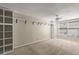 Spacious bedroom with large windows, neutral carpet, and built-in shelving for ample storage at 1371 Keys Lake Ne Dr, Brookhaven, GA 30319