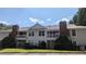 Attractive condominium building with large balconies, brick accents, and well-manicured lawn at 1371 Keys Lake Ne Dr, Brookhaven, GA 30319