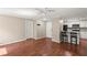 Spacious living area with wood floors open to a modern kitchen with granite counters at 1371 Keys Lake Ne Dr, Brookhaven, GA 30319