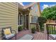 Cozy back deck featuring outdoor seating, perfect for enjoying the peaceful surroundings at 1694 Peachcrest Ct, Lawrenceville, GA 30043
