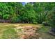 Expansive backyard with mature trees, offering plenty of space and privacy at 1694 Peachcrest Ct, Lawrenceville, GA 30043