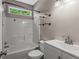 Bathroom featuring tile shower and vanity sink at 1694 Peachcrest Ct, Lawrenceville, GA 30043