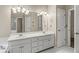 Bathroom with double vanity, soaking tub, and natural light at 1694 Peachcrest Ct, Lawrenceville, GA 30043
