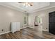 Bedroom showcasing hardwood floors, with archway and window offering natural light at 1694 Peachcrest Ct, Lawrenceville, GA 30043