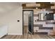Welcoming entryway featuring wood accent wall, mirror, and wood flooring at 1694 Peachcrest Ct, Lawrenceville, GA 30043