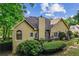 Home exterior showing a deck area, well-maintained landscaping, and architectural details at 1694 Peachcrest Ct, Lawrenceville, GA 30043