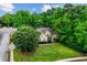 Exterior elevation of a traditional style home showcasing meticulous landscaping and a well-manicured lawn at 1694 Peachcrest Ct, Lawrenceville, GA 30043