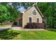 Exterior view of the home with attached garage and well-maintained landscaping at 1694 Peachcrest Ct, Lawrenceville, GA 30043