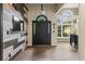 Stunning foyer with wood accent wall and ample natural light from large windows at 1694 Peachcrest Ct, Lawrenceville, GA 30043