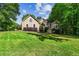 Charming home with a beautifully manicured front yard and mature trees at 1694 Peachcrest Ct, Lawrenceville, GA 30043