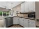 Bright kitchen featuring modern appliances and granite countertops at 1694 Peachcrest Ct, Lawrenceville, GA 30043