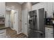 Kitchen with stainless refrigerator and view to hallways at 1694 Peachcrest Ct, Lawrenceville, GA 30043