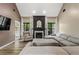 Bright living room featuring a fireplace, comfortable seating, and large windows at 1694 Peachcrest Ct, Lawrenceville, GA 30043
