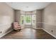 Sitting area with bay window and a cozy pink rocking chair at 1694 Peachcrest Ct, Lawrenceville, GA 30043