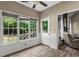 Sunroom featuring bright windows and outside view at 1694 Peachcrest Ct, Lawrenceville, GA 30043