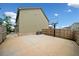 The expansive fenced backyard features a concrete patio and a basketball hoop at 4814 Sultana Sw Way, Atlanta, GA 30331