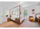 Serene bedroom featuring a canopy bed and a window with natural light at 4814 Sultana Sw Way, Atlanta, GA 30331