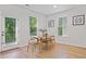 Cozy dining area with modern furniture, a view of the lush backyard, and ample natural light at 4814 Sultana Sw Way, Atlanta, GA 30331