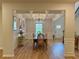 Elegant dining room with coffered ceiling, modern chandelier, and wainscoting details at 4814 Sultana Sw Way, Atlanta, GA 30331