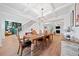 Bright dining room with views to the stairs and living room with fireplace at 4814 Sultana Sw Way, Atlanta, GA 30331
