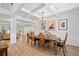 Elegant dining room with coffered ceilings, chandelier, and hardwood floors at 4814 Sultana Sw Way, Atlanta, GA 30331