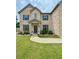 Beautiful brick house with a well-maintained lawn and a stone-lined flower bed at 4814 Sultana Sw Way, Atlanta, GA 30331