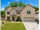 Charming two-story brick home with a manicured lawn and attached two car garage at 4814 Sultana Sw Way, Atlanta, GA 30331