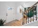 Bright, freshly painted foyer with natural lighting and wood-look floors at 4814 Sultana Sw Way, Atlanta, GA 30331