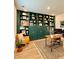 Well-appointed home office with stylish decor, custom shelving, and a comfortable desk setup at 4814 Sultana Sw Way, Atlanta, GA 30331