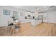 Bright eat-in kitchen boasts stainless steel appliances, white cabinetry, and an island with barstool seating at 4814 Sultana Sw Way, Atlanta, GA 30331
