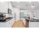 Modern kitchen with stainless steel appliances, white cabinets, and a spacious island at 4814 Sultana Sw Way, Atlanta, GA 30331