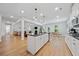 Spacious kitchen with stainless steel appliances, an island with breakfast bar, and open access to the living area at 4814 Sultana Sw Way, Atlanta, GA 30331