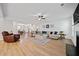 Spacious open-concept living room with luxury vinyl plank flooring, neutral decor, and abundant natural light at 4814 Sultana Sw Way, Atlanta, GA 30331