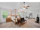 Spacious main bedroom includes a four-poster bed, ceiling fan, and workout equipment at 4814 Sultana Sw Way, Atlanta, GA 30331