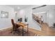 Bright home office with wood desk, brown rug, and modern decor at 4814 Sultana Sw Way, Atlanta, GA 30331