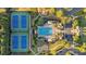 A top-down aerial view of neighborhood amenities, including tennis courts and a swimming pool at 4845 Backbay St, Suwanee, GA 30024