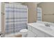 Clean bathroom featuring a vanity with a white cabinet, a sink, and a shower at 4845 Backbay St, Suwanee, GA 30024