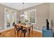 Bright dining area features hardwood floors and access to the outdoor living space at 4845 Backbay St, Suwanee, GA 30024