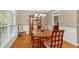 Elegant dining room features hardwood floors, a chandelier, and wainscoting at 4845 Backbay St, Suwanee, GA 30024