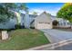 Exterior of a well-maintained home with a two-car garage, driveway, and landscaped lawn at 4845 Backbay St, Suwanee, GA 30024