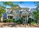 Charming two-story home featuring a stone facade, covered porch, and well-maintained landscaping at 4845 Backbay St, Suwanee, GA 30024