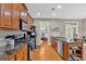 Spacious kitchen featuring granite counters, stainless appliances, and hardwood floors at 4845 Backbay St, Suwanee, GA 30024