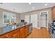 Well-equipped kitchen with granite countertops, stainless steel appliances, and wood cabinetry at 4845 Backbay St, Suwanee, GA 30024