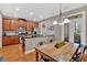 Eat-in kitchen with stainless appliances, wood cabinets, and a sunny breakfast nook at 4845 Backbay St, Suwanee, GA 30024