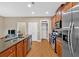 Stylish kitchen featuring stainless steel appliances and a view into the breakfast area at 4845 Backbay St, Suwanee, GA 30024