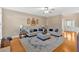Bright living room with hardwood floors, neutral walls, and comfortable seating at 4845 Backbay St, Suwanee, GA 30024