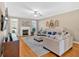 Bright and airy living room with a fireplace, hardwood floors, and stylish decor at 4845 Backbay St, Suwanee, GA 30024