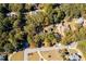 Overhead shot of houses in the neighborhood surrounded by green lush trees at 965 Sundew Se Dr, Conyers, GA 30013